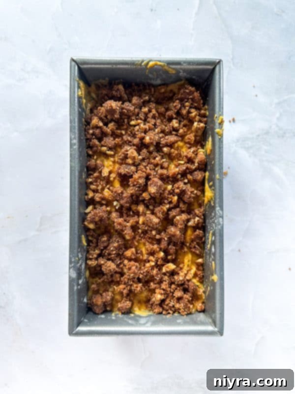 Pumpkin Zucchini Crumble Loaf 12 Pouring Pumpkin Zucchini Streusel Bread batter into loaf pans