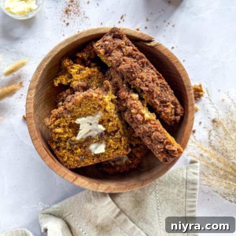 Pumpkin Zucchini Crumble Loaf 16 Close up of Pumpkin Zucchini Streusel Bread slice on a plate