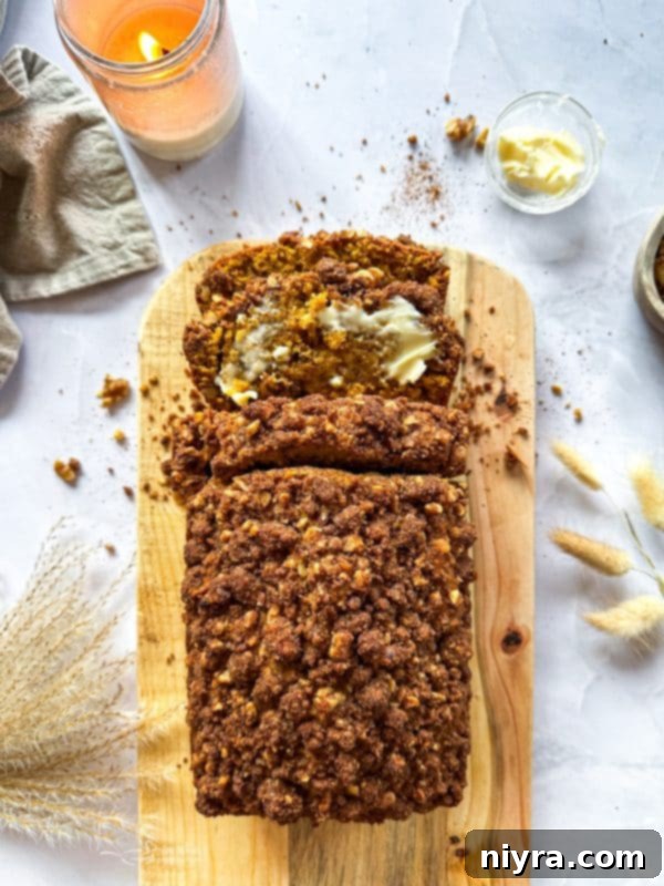 Pumpkin Zucchini Crumble Loaf 17 Pumpkin Zucchini Streusel Bread sliced on a cooling rack