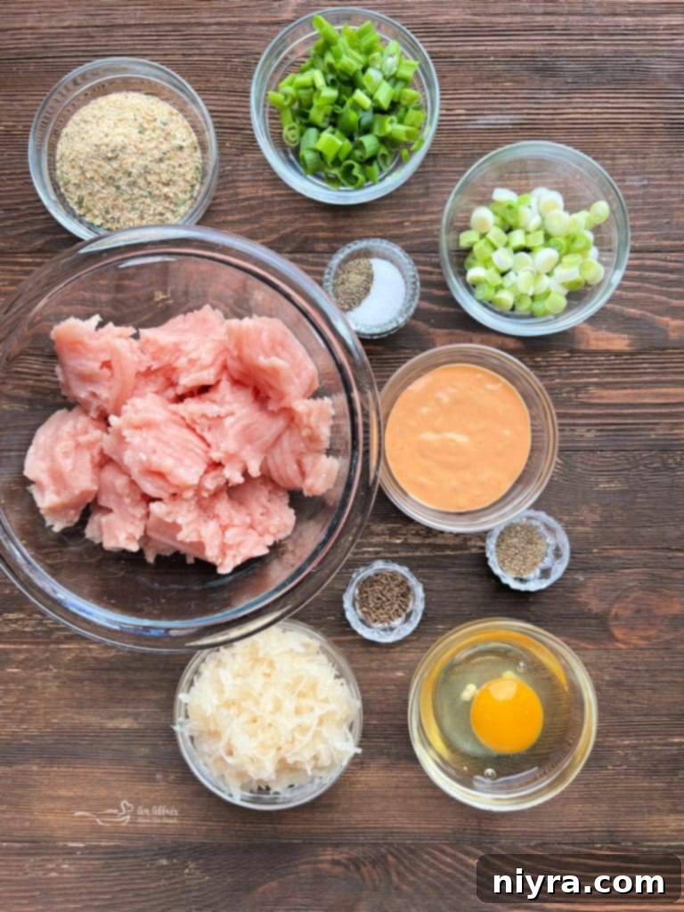 A close-up of a fully dressed Turkey Reuben Burger with Thousand Island and green onions.