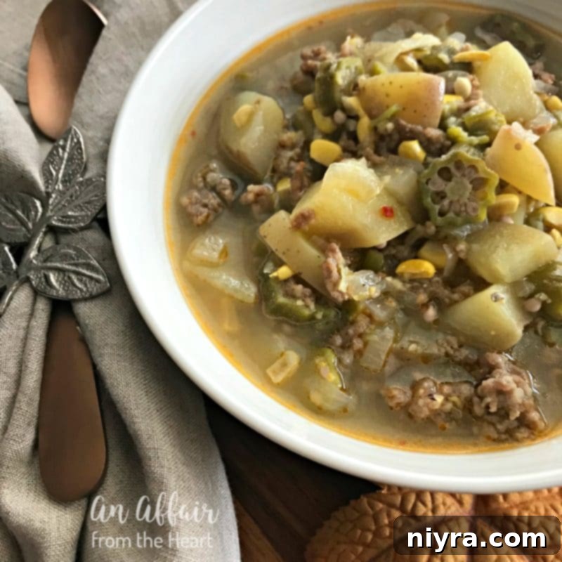 Rustic Harvest Stew simmering in a Dutch oven