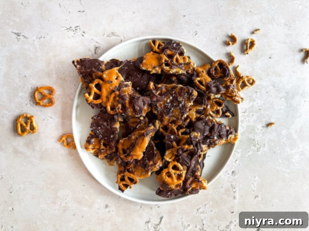 Salted Caramel Chocolate Pretzel Bars 6 Close-up of a stack of Salted Caramel Chocolate Pretzel Bars, showcasing the layers and texture.