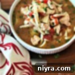 Italian Chicken Noodle Soup in a white bowl