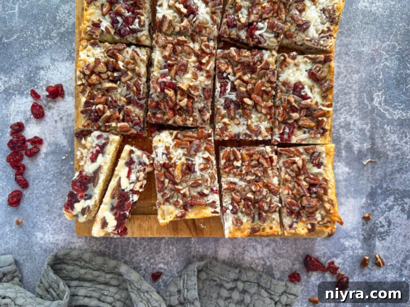 Close-up of baked Double Chocolate Cranberry Magic Bars, showing melted chocolate and golden crust