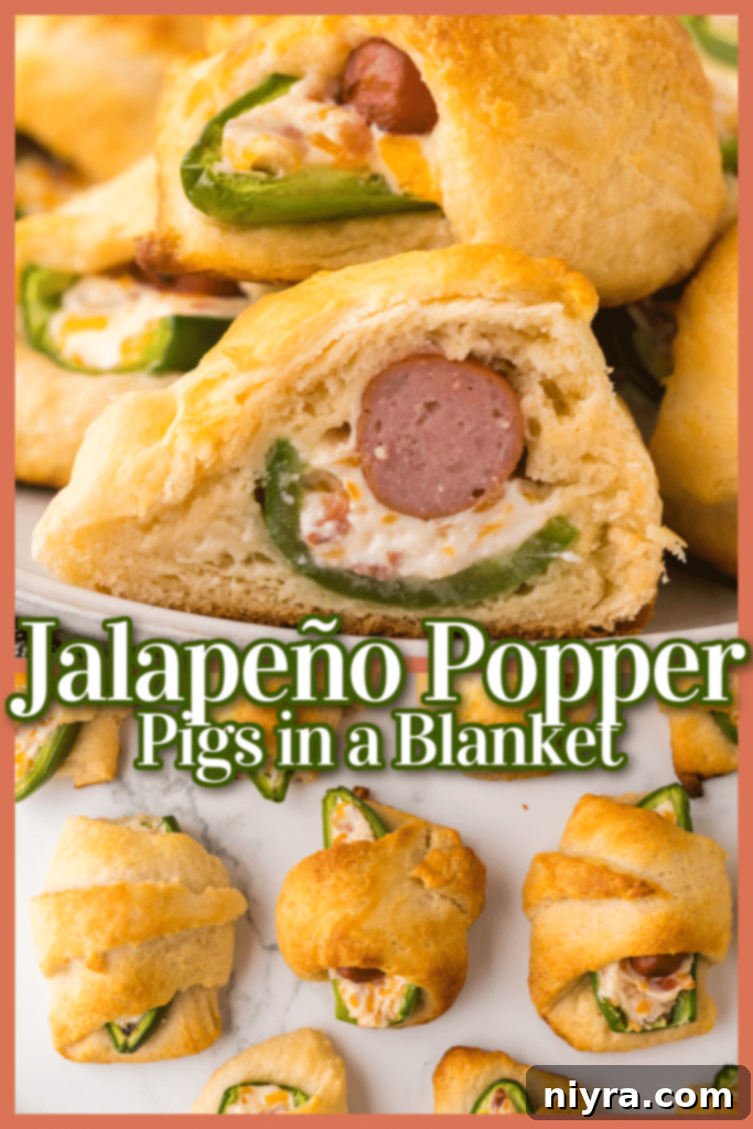 Serving platter of Jalapeño Popper Pigs in a Blanket with a small bowl of dipping sauce