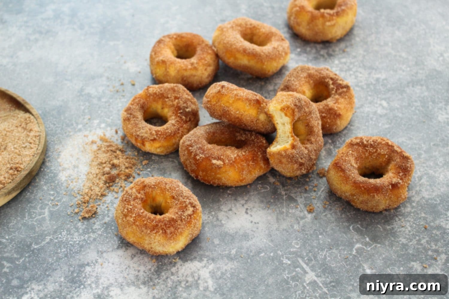 Easy Air Fryer Biscuit Donuts 6 Ingredients for air fryer biscuit donuts: biscuits, sugar, cinnamon, butter
