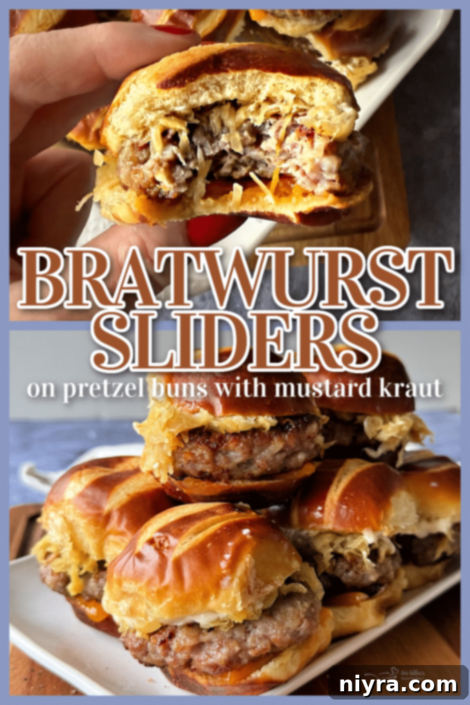 Bratwurst Sliders baked to perfection in a baking dish, with melty cheese and golden buns.