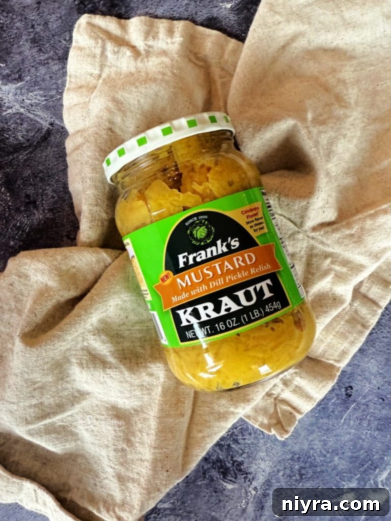 A close-up of several Bratwurst Sliders arranged neatly on a cutting board, ready to be served.