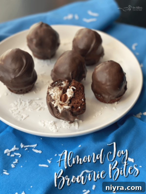 Almond Joy Brownie Bites elegantly presented on a white plate, ready to be served.