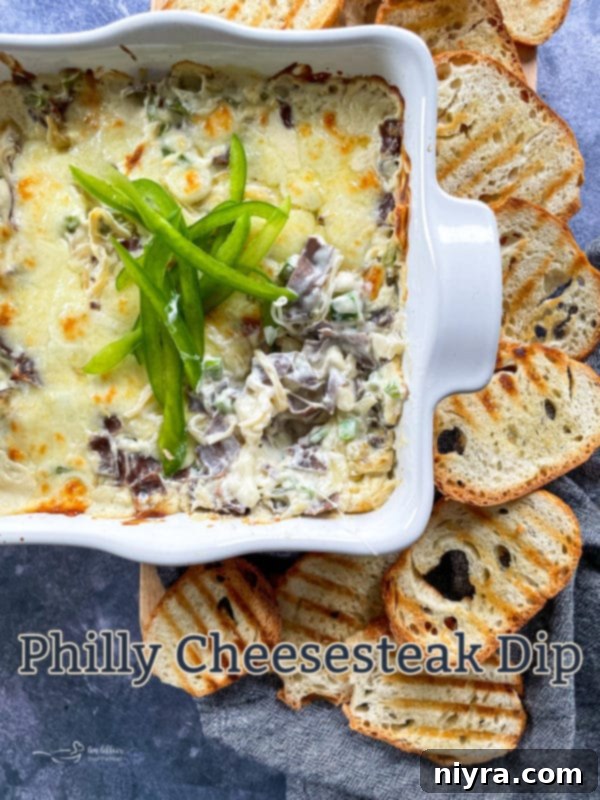 Baked Philly Dip in a serving dish, close up