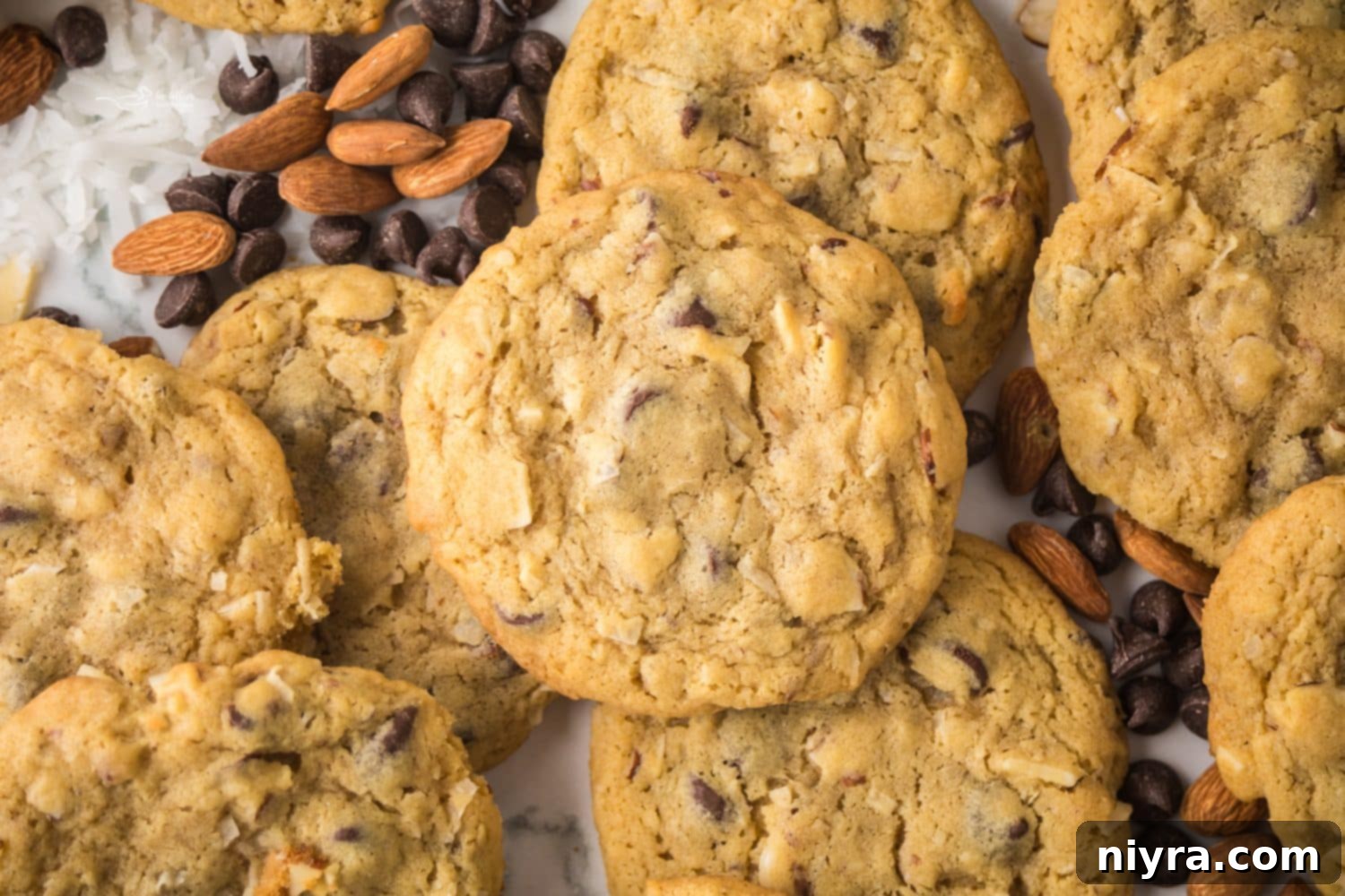 A close-up of an Almond Joy Cookie showing its texture and ingredients