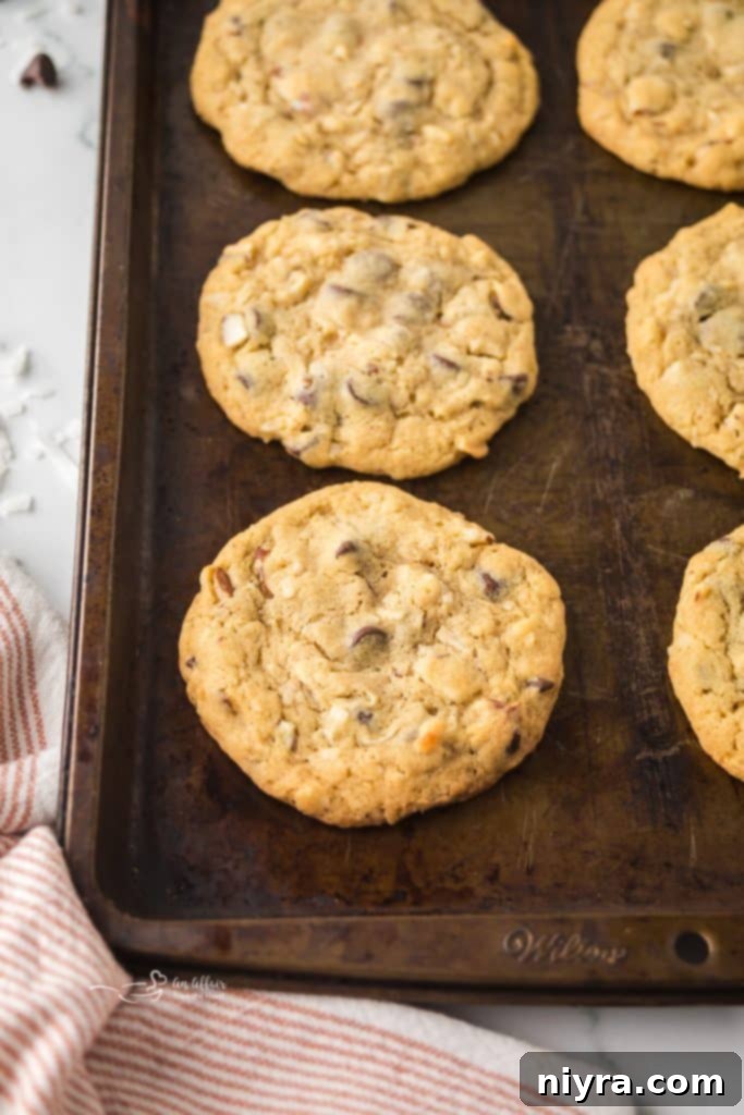 Almond Joy Cookies cooling on a baking sheet