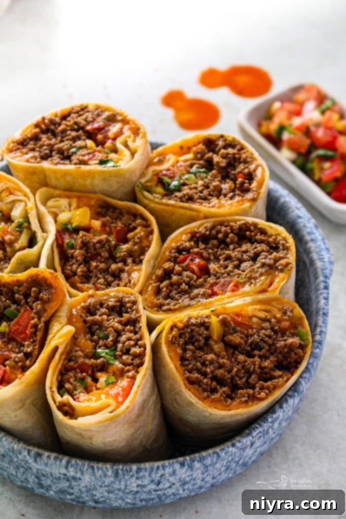 A stack of perfectly cooked homemade Meximelts on a wooden surface.