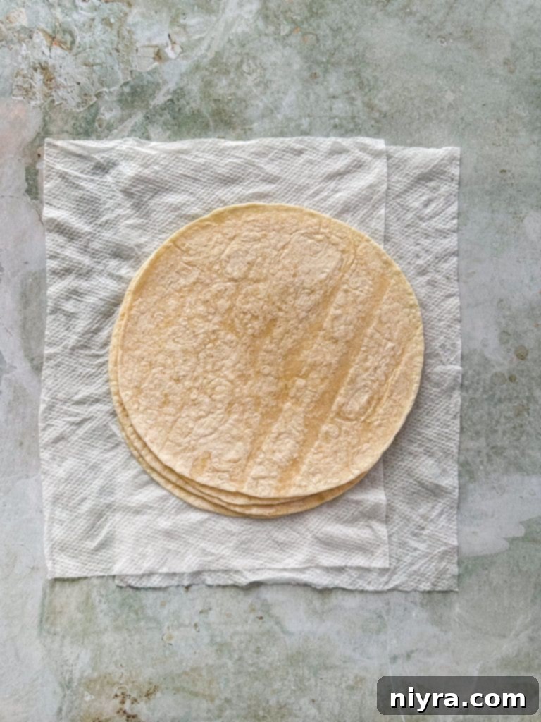Finely crumbled, seasoned ground beef in a skillet.
