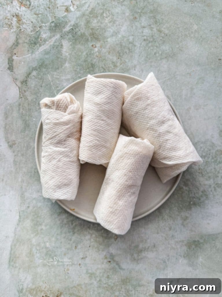 A rolled homemade Meximelt, ready for melting the cheese.