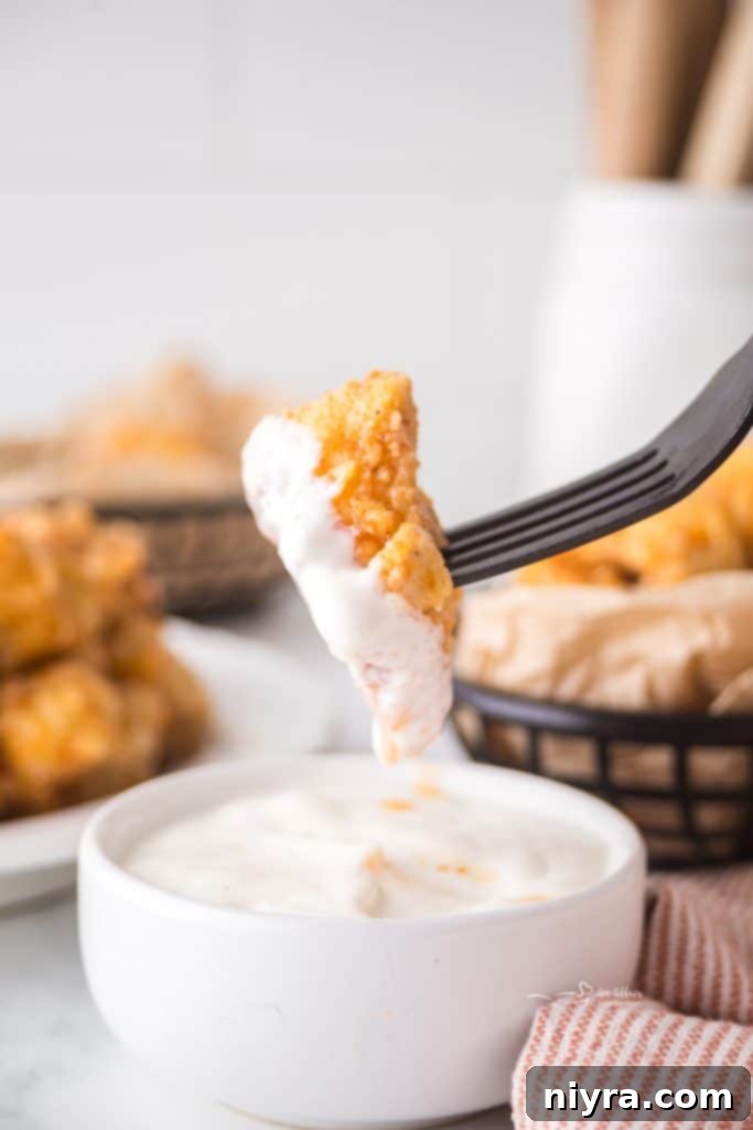 Fiery Honey Crispy Chicken Bites 11 Close up of golden crispy popcorn chicken.