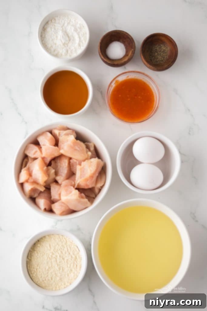 Fiery Honey Crispy Chicken Bites 4 Close up of a single piece of Hot Honey Popcorn Chicken.