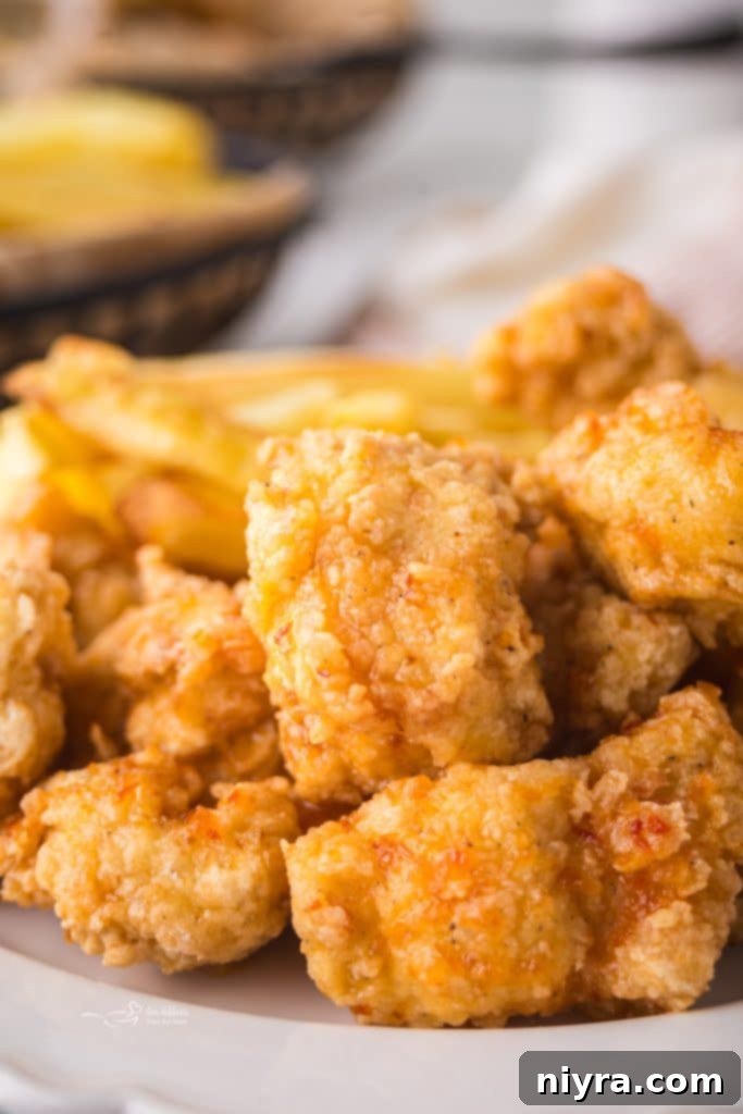 Fiery Honey Crispy Chicken Bites 10 Pinterest pin for Hot Honey Popcorn Chicken.