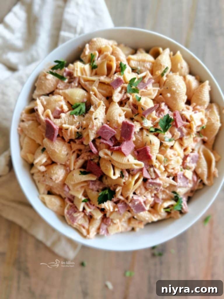 Reuben Pasta Salad with a full serving on a wooden background