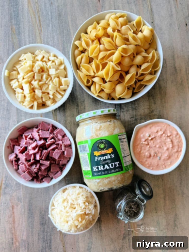 Reuben Pasta Salad in a white bowl, close-up with a spoon