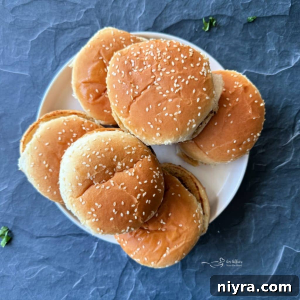 Finished Mexican burgers with melted cheese on the grill.