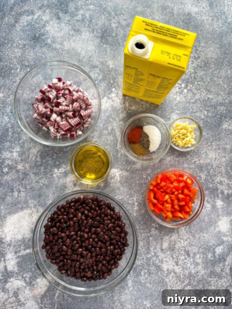 A close-up of the smooth, dark texture of the black bean soup.