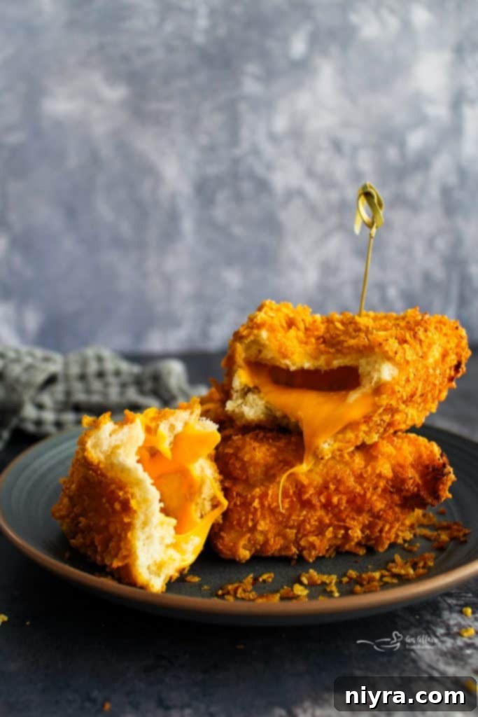 A perfectly fried Cheese Frenchee, golden brown and crispy.