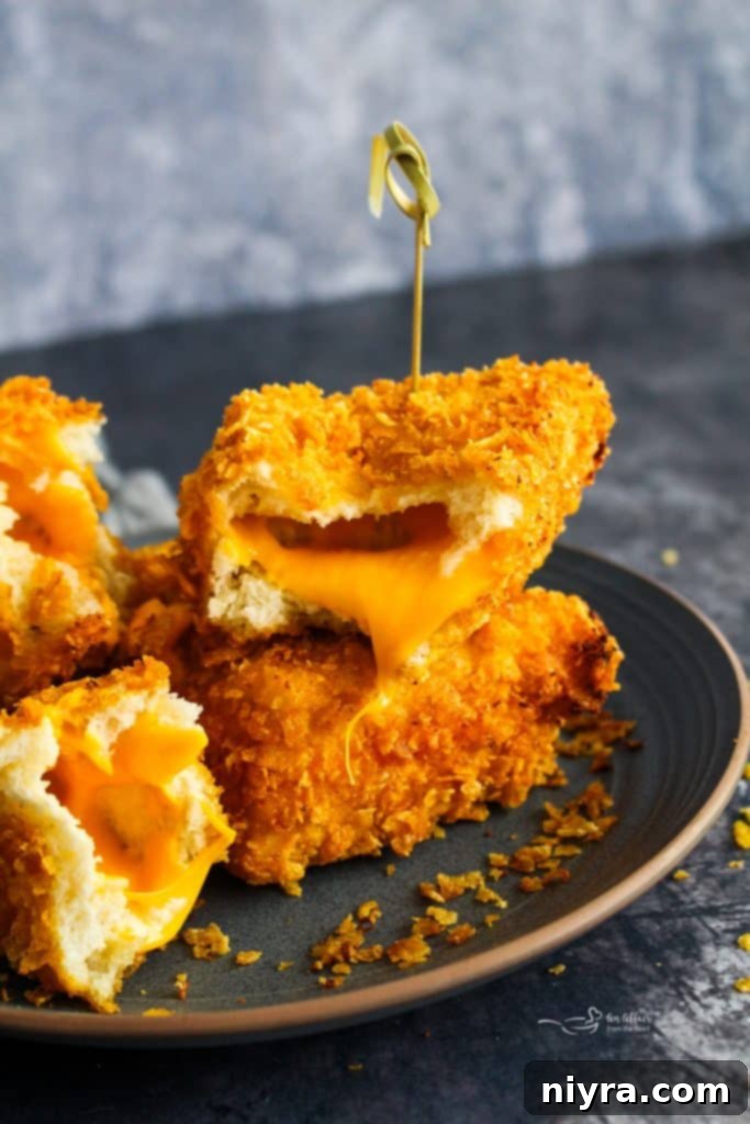 Ingredients laid out for making Cheese Frenchees: bread, cheese, cornflakes, and wet batter ingredients.