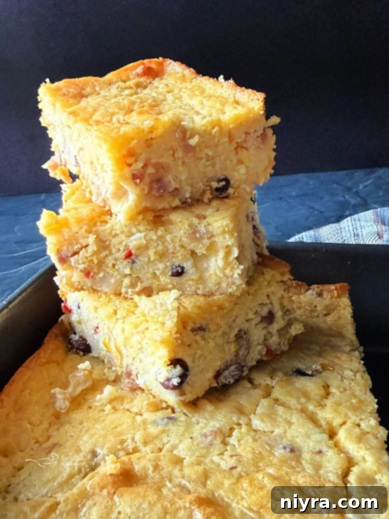 Close-up shot of Cowboy Corn Casserole with Cowboy Caviar, showcasing the texture and vibrant colors.