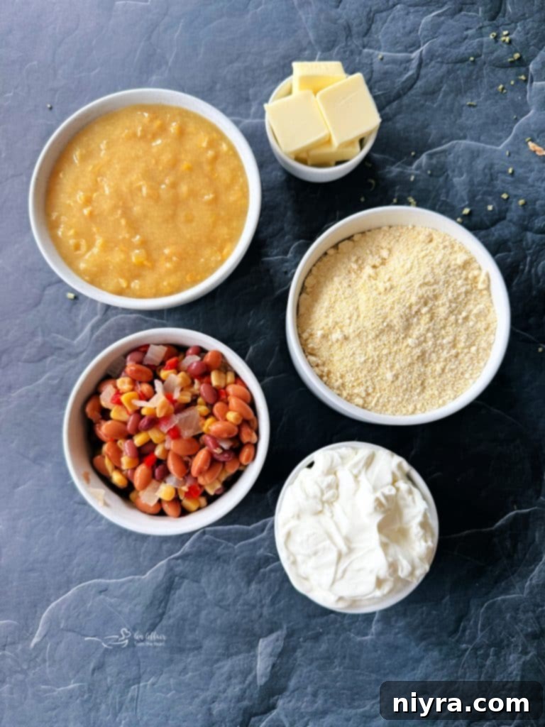 Serving of Cowboy Corn Casserole on a plate, highlighting the creamy texture and colorful Cowboy Caviar.