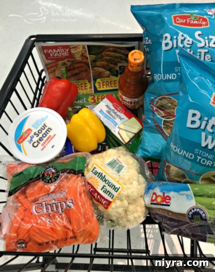 Shopping cart with groceries, including cauliflower, at Family Fare