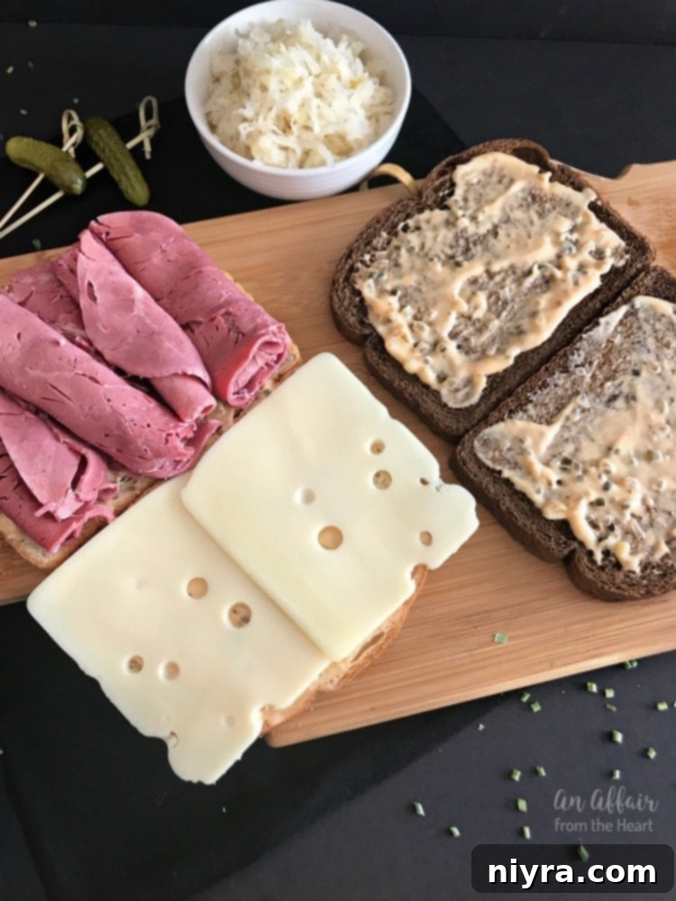 Authentic Reuben Sandwich 10 Preparing the first layer of a Reuben sandwich with dressing