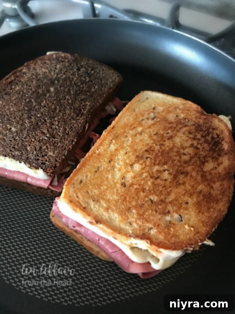 Authentic Reuben Sandwich 12 Adding Frank's Kraut generously to the Reuben sandwich