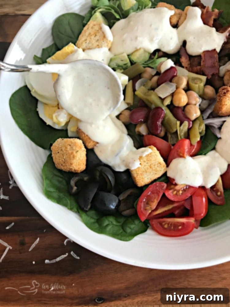 Loaded Spinach Salad with Creamy Roasted Garlic Dressing - a vibrant and hearty meal