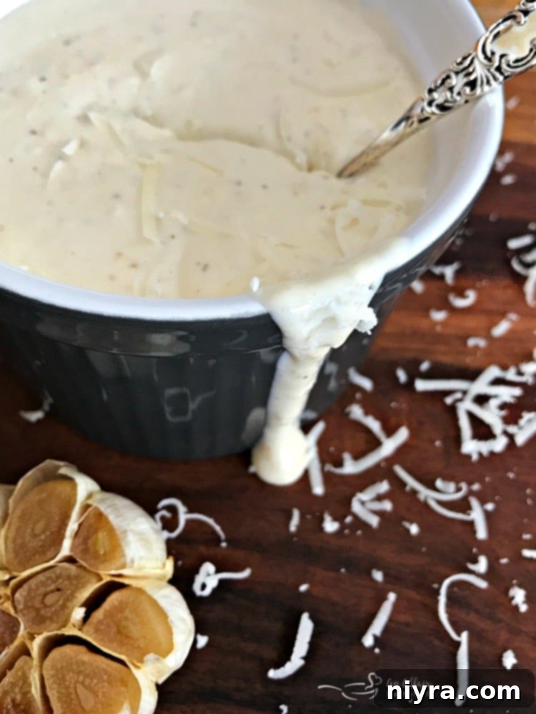 Close-up of the Creamy Roasted Garlic Dressing in a jar.