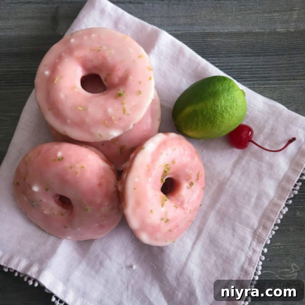 Sweet-Tart Cherry Lime Baked Donuts 2 Cherry Limeade Baked Donuts - Fluffy pink cake donuts with a tart lime glaze.