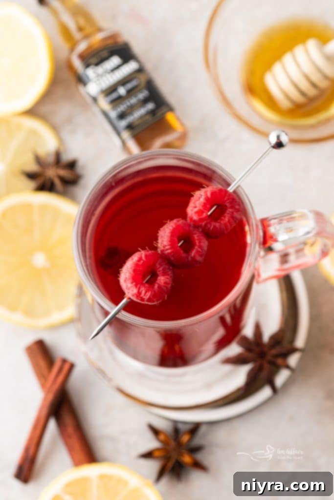 Raspberry Hot Toddy: A Soothing Cold Remedy 8 Raspberry Hot Toddy garnished with raspberries